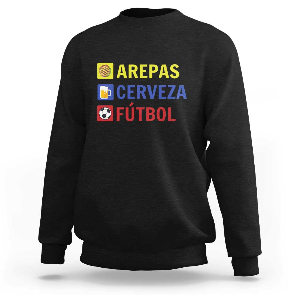 Black sweatshirt with Arepas Cerveza Fútbol graphic and small icons