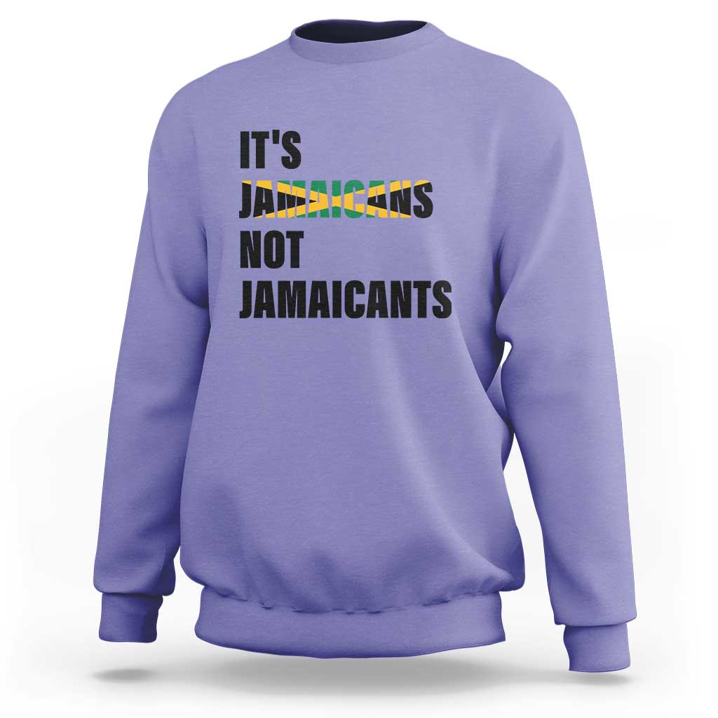 Lavender sweatshirt with bold “It’s Jamaicans Not Jamaicants” text graphic on chest
