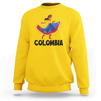 Yellow Colombia cumbia sweatshirt with dancer graphic and “COLOMBIA” text