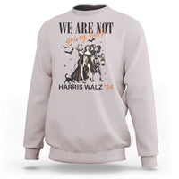 Ice gray crewneck sweatshirt with 'WE ARE NOT' witch graphic, lantern, and 'HARRIS WALZ '24' text