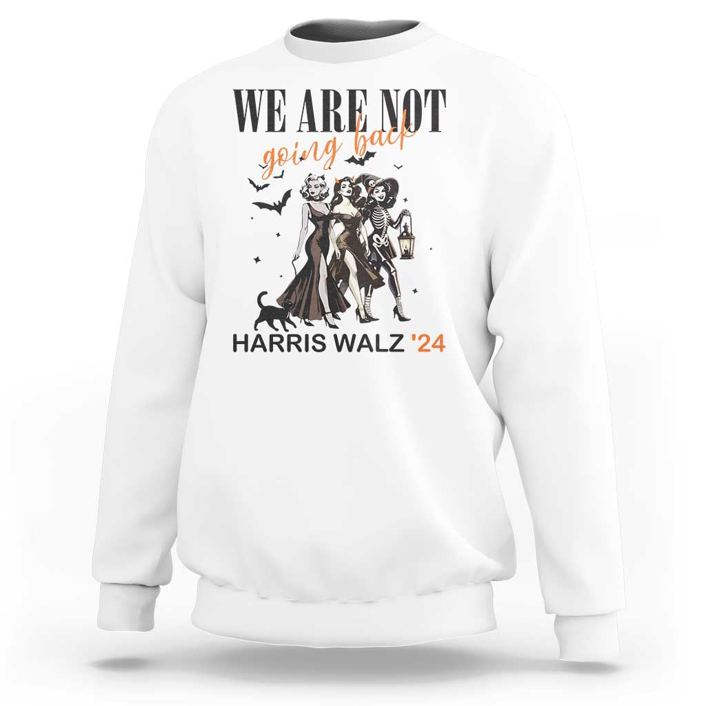 White crewneck sweatshirt with 'WE ARE NOT' witch graphic, lantern, and 'HARRIS WALZ '24' text