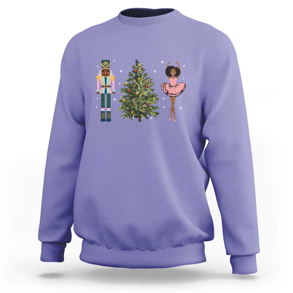 Violet crewneck Christmas sweatshirt with nutcracker, tree, and ballerina graphic on chest