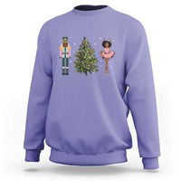 Violet crewneck Christmas sweatshirt with nutcracker, tree, and ballerina graphic on chest
