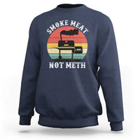 Navy crewneck sweatshirt with “SMOKE MEAT NOT METH” grill graphic on the chest