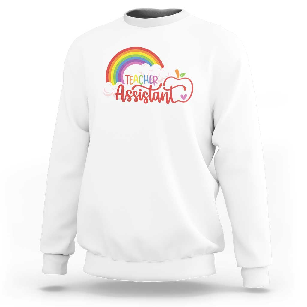 White teacher assistant sweatshirt with rainbow cloud apple graphic on front.