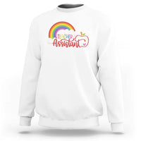White teacher assistant sweatshirt with rainbow cloud apple graphic on front.