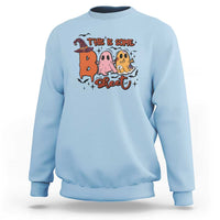 Light blue crewneck sweatshirt with Halloween 'This is some sweet' ghost witch graphic