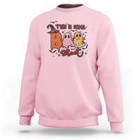 Light pink crewneck sweatshirt with Halloween 'This is some sweet' ghost witch graphic
