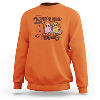 Orange crewneck sweatshirt with Halloween 'This is some sweet' ghost witch graphic