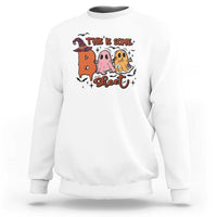 White crewneck sweatshirt with Halloween 'This is some sweet' ghost witch graphic