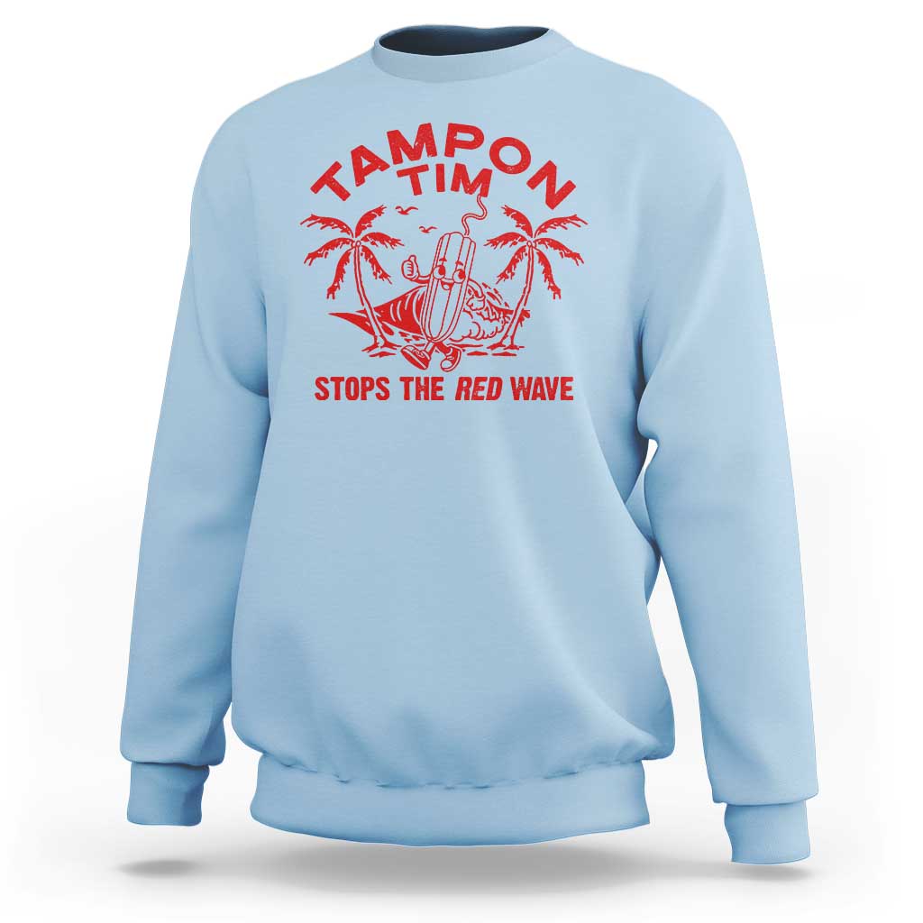 Light blue crewneck sweatshirt with red palm graphic and 'STOPS THE RED WAVE' text
