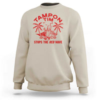 Sand-colored crewneck sweatshirt with red palm graphic and 'STOPS THE RED WAVE' text
