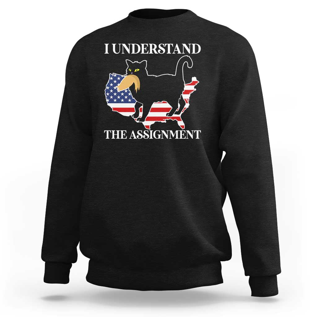 Black crewneck sweatshirt with cat-and-flag graphic and 'I understand the assignment' text