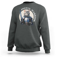 Dark gray sweatshirt with kitten knight graphic and “JOYFUL WARRIOR” text on chest