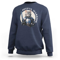 Slate blue sweatshirt with kitten knight graphic and “JOYFUL WARRIOR” text on chest