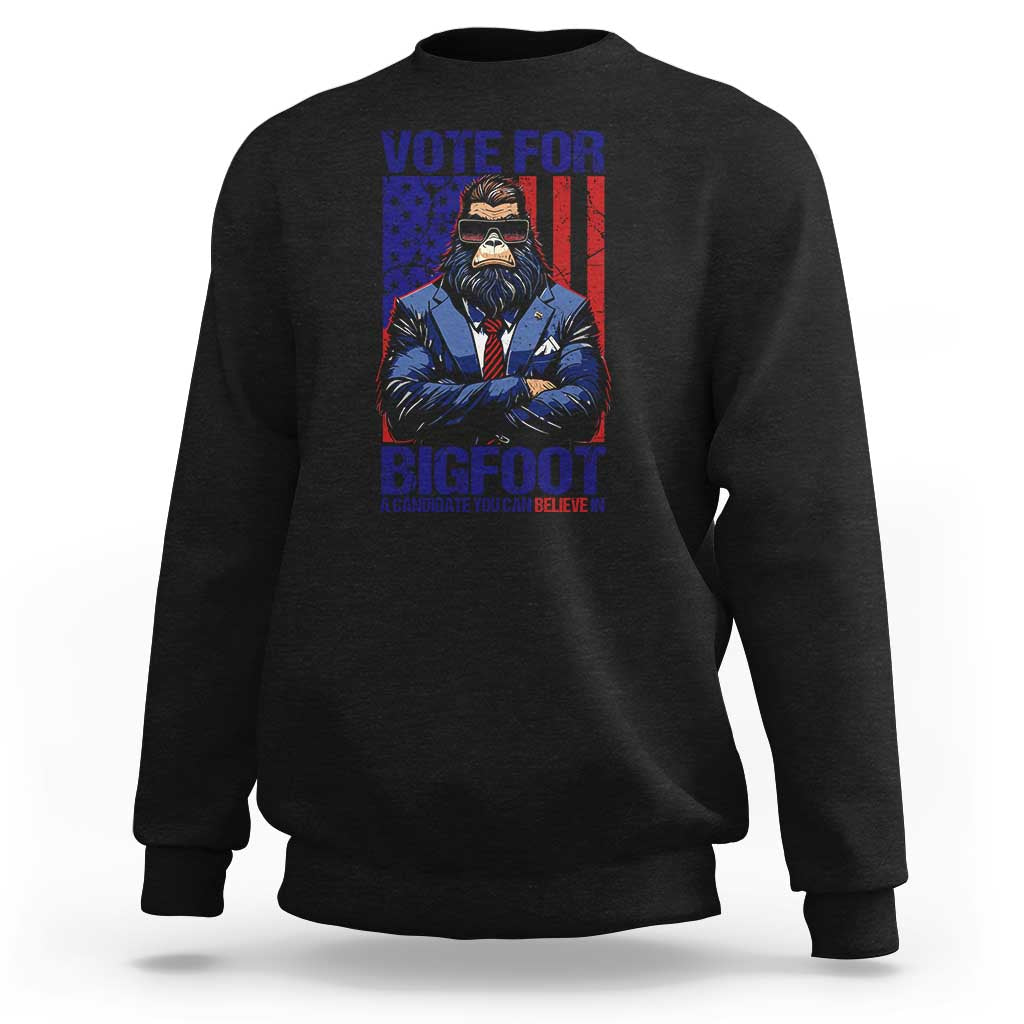 Black crewneck sweatshirt with Bigfoot election graphic on the front