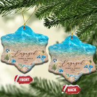 Personalized engagement Christmas ornament pair, star shapes with blue ocean beach and “Engaged”.