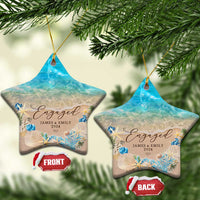 Personalized engagement Christmas ornament pair, star shapes with blue ocean beach and “Engaged”.