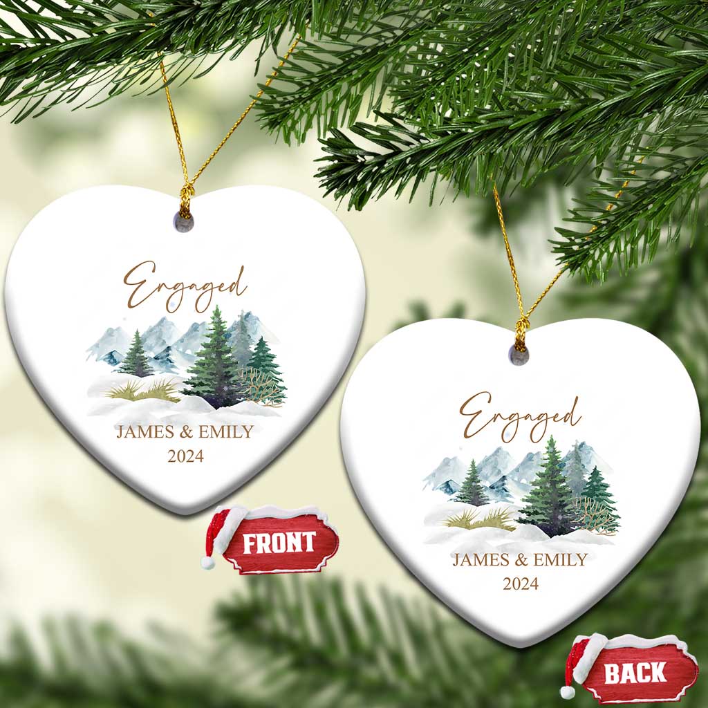 Engaged heart-shaped Christmas ornaments with gold strings, snowy forest, JAMES & EMILY, 2024