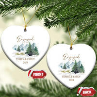 Engaged heart-shaped Christmas ornaments with gold strings, snowy forest, JAMES & EMILY, 2024