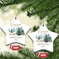Engaged star-shaped Christmas ornaments with gold strings, snowy forest, JAMES & EMILY, 2024