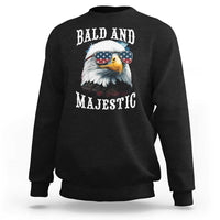 Black sweatshirt with eagle sunglasses graphic, American flag, and “BALD AND MAJESTIC”