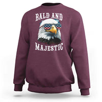 Maroon sweatshirt with eagle sunglasses graphic, American flag, and “BALD AND MAJESTIC”