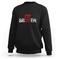 Black crewneck sweatshirt with “BROKEN” red-and-white graphic on front