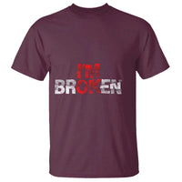 Maroon short-sleeve T-shirt with distressed red-and-white "I'm OK I'm Broken" graphic