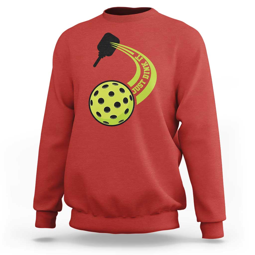 Red sweatshirt with pickleball paddle and green pickle graphic on chest