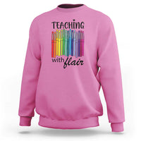 Azalea pink sweatshirt with “Teaching with Flair” pencil graphic, crewneck long sleeves.