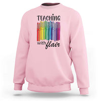 Light pink sweatshirt with “Teaching with Flair” pencil graphic, crewneck long sleeves.