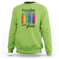 Lime green sweatshirt with “Teaching with Flair” pencil graphic, crewneck long sleeves.