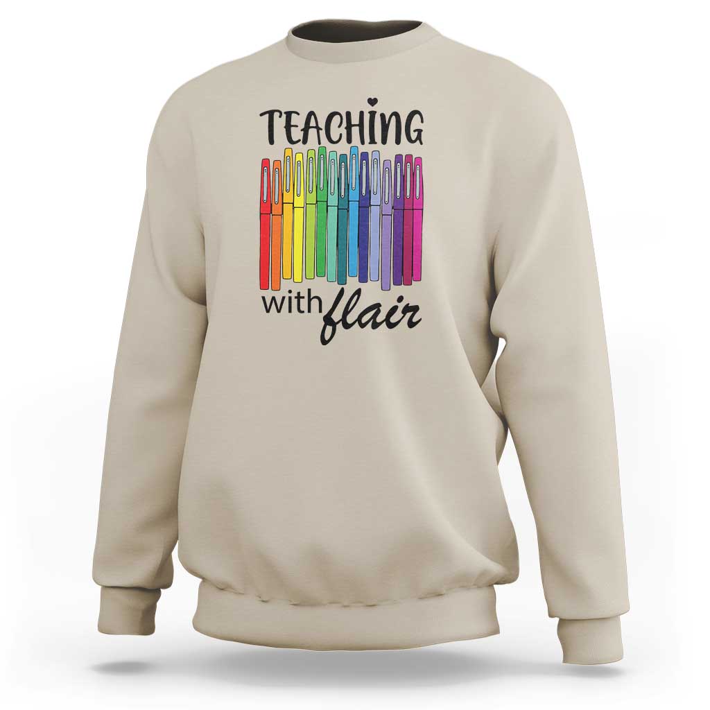 Sand sweatshirt with “Teaching with Flair” pencil graphic, crewneck long sleeves.
