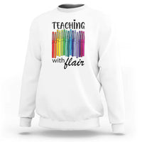 White sweatshirt with “Teaching with Flair” pencil graphic, crewneck long sleeves.