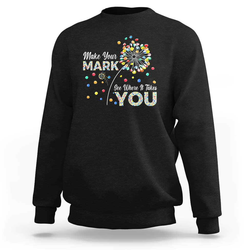 Black crewneck sweatshirt with colorful dandelion dot graphic and motivational text on chest