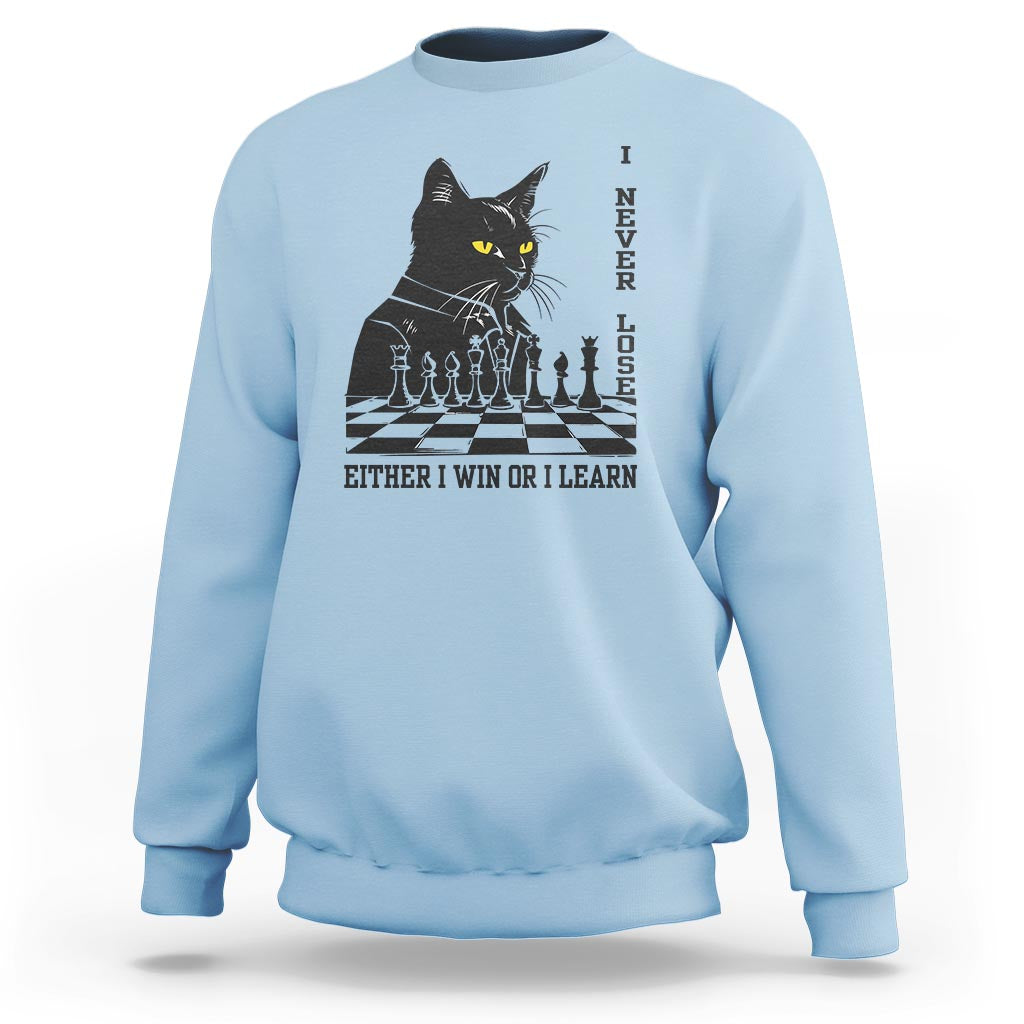 Chess lover sweatshirt, light blue with black cat over chessboard graphic and slogan