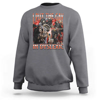 Dark heather gray crewneck sweatshirt with long sleeves and front graphic text skull print