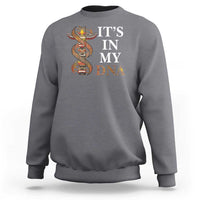 Gray sweatshirt with "IT'S IN MY DNA" totem graphic on chest