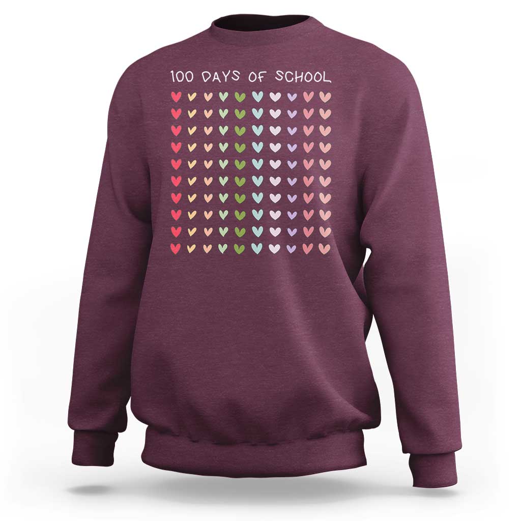 Maroon crewneck sweatshirt with “100 days of school” and pastel heart grid on front