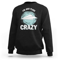 Black crewneck sweatshirt with front plane graphic and 'CRAZY' text, long sleeves