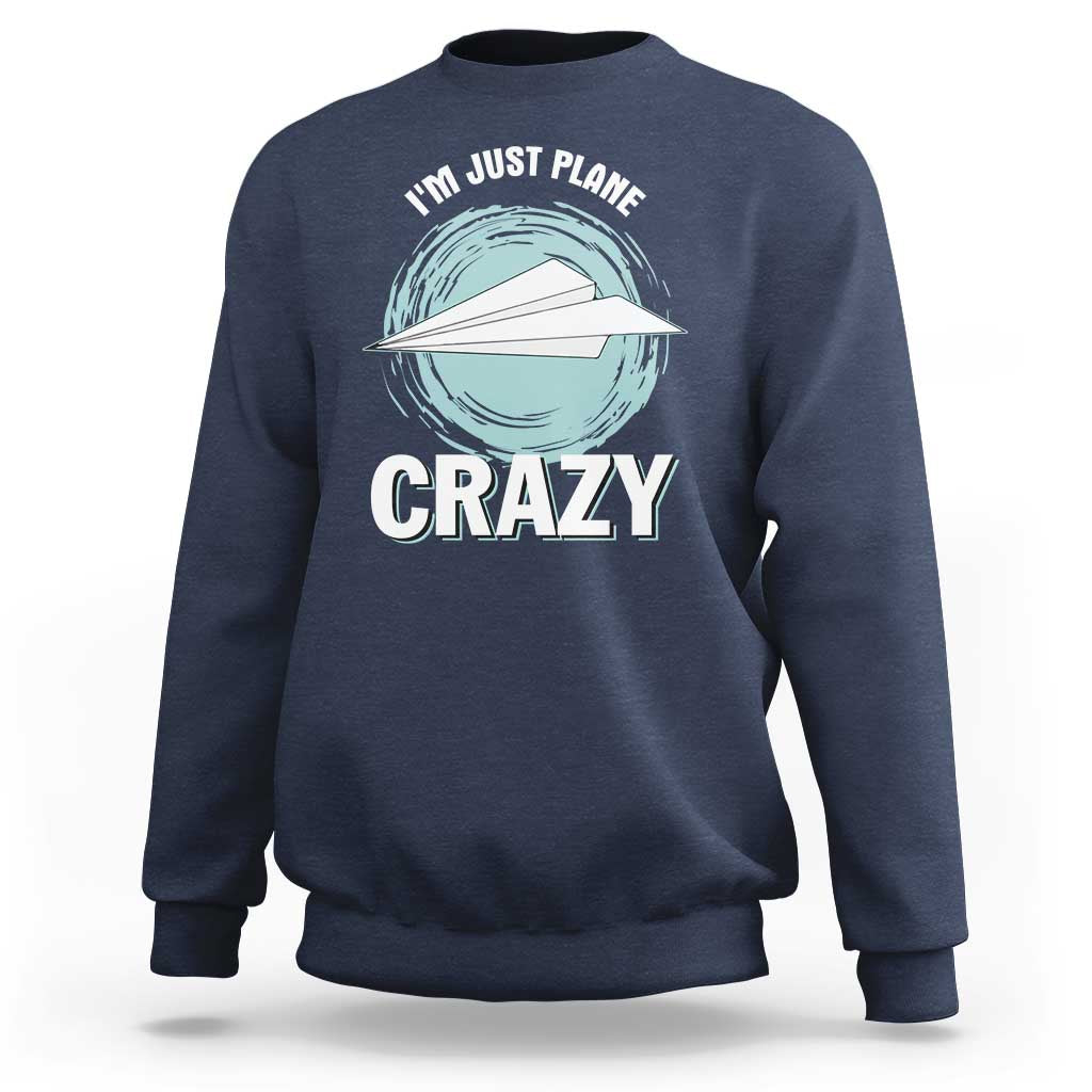Navy crewneck sweatshirt with front plane graphic and 'CRAZY' text, long sleeves