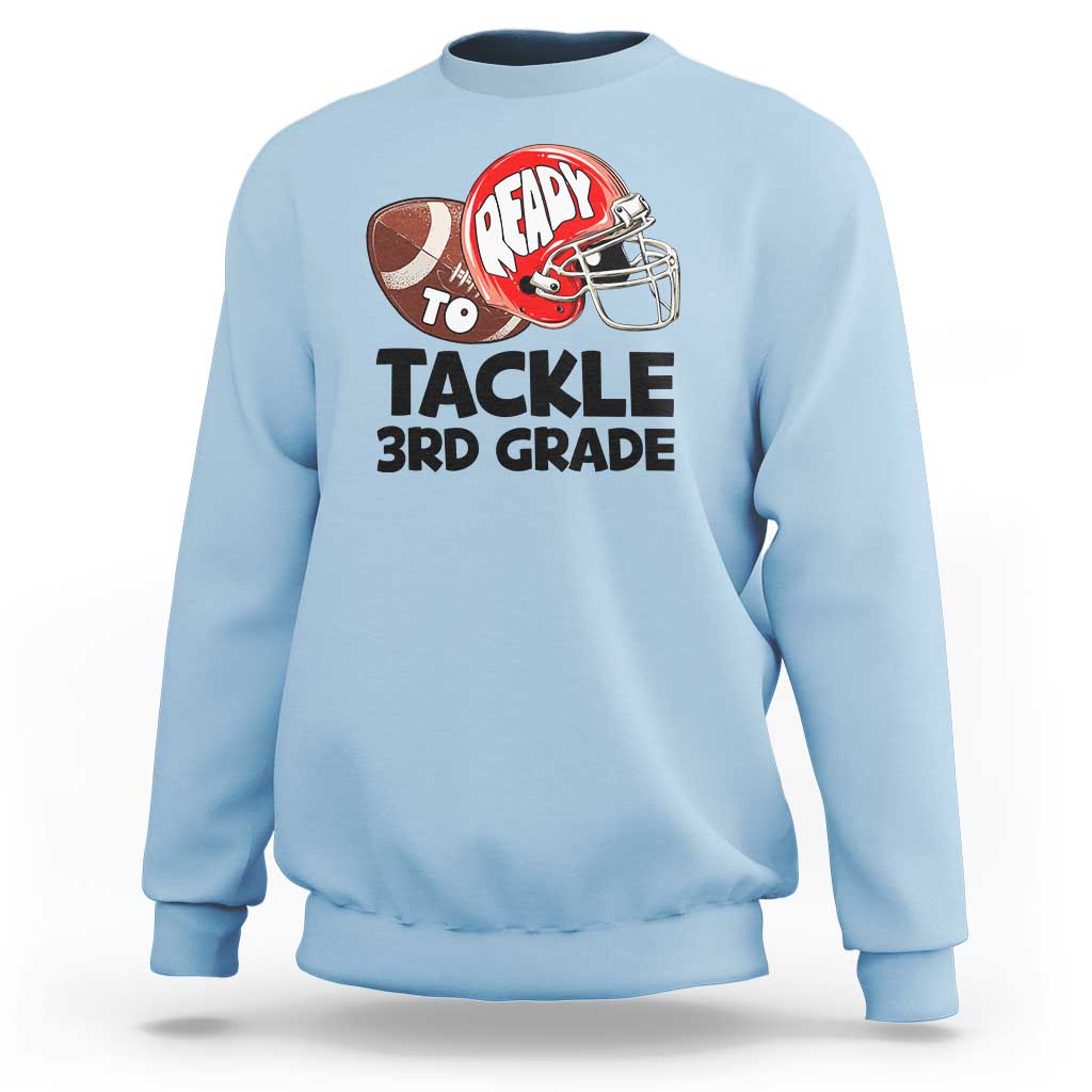 Sky blue crewneck sweatshirt featuring football helmet "Ready to Tackle 3rd Grade"
