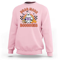 Pink sweatshirt with cute ghost reading a book graphic, "READ MORE" and "BOOOOOKS".