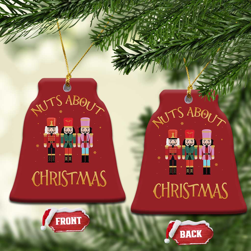 Set of 2 red bell-shaped Christmas ornaments with “Nuts About Christmas” nutcracker figures
