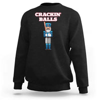 Black baseball sweatshirt with nutcracker graphic and 'CRACKIN' BALLS' text on back
