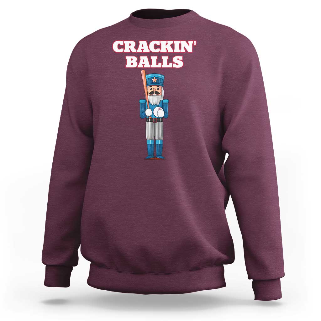 Maroon baseball sweatshirt with nutcracker graphic and 'CRACKIN' BALLS' text on back