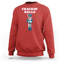 Red baseball sweatshirt with nutcracker graphic and 'CRACKIN' BALLS' text on back