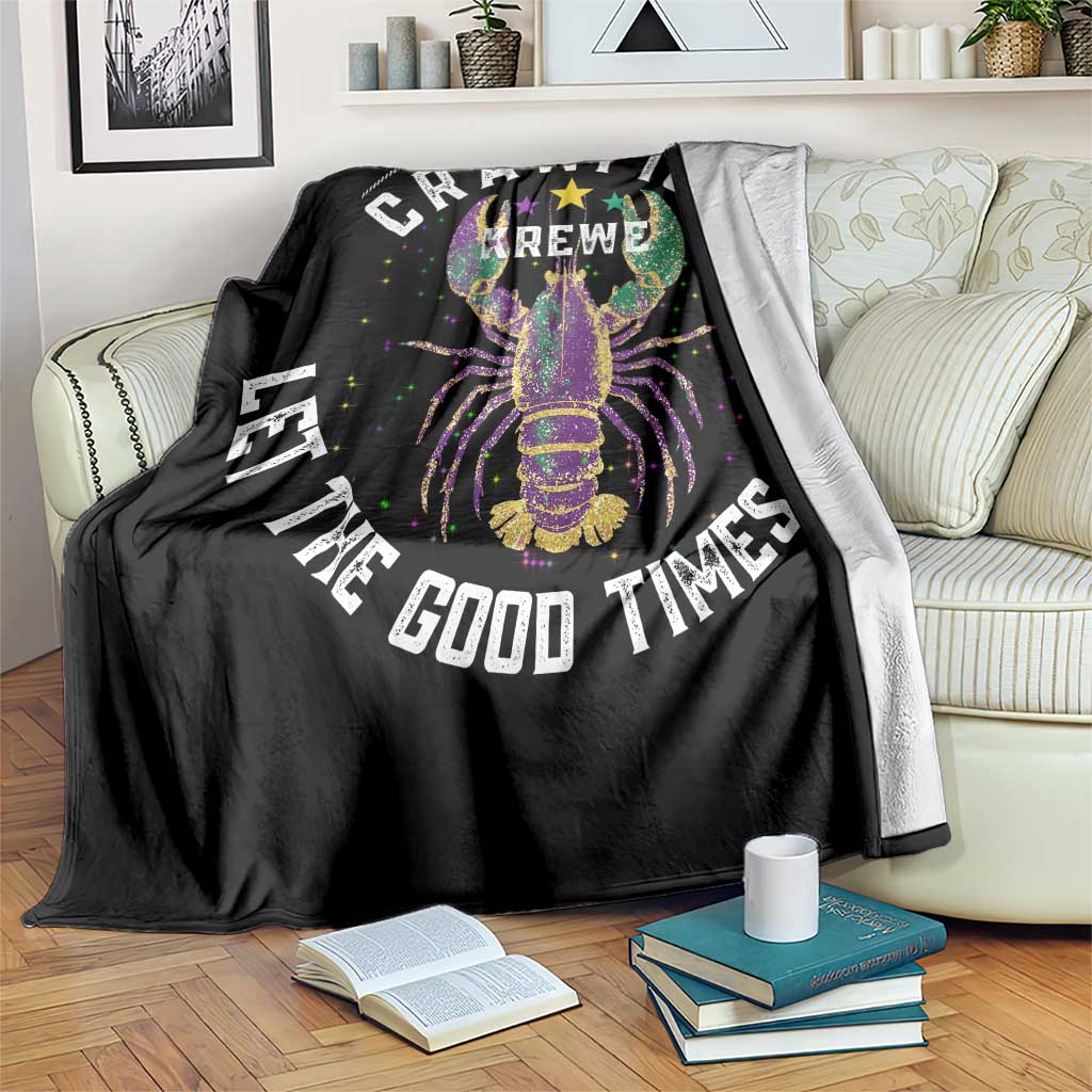 Black throw blanket draped over a chair, showing colorful crawfish art and “Good Times Roll”