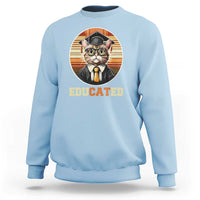 Light blue cat graduation sweatshirt with 'Educated' graduation hat graphic.